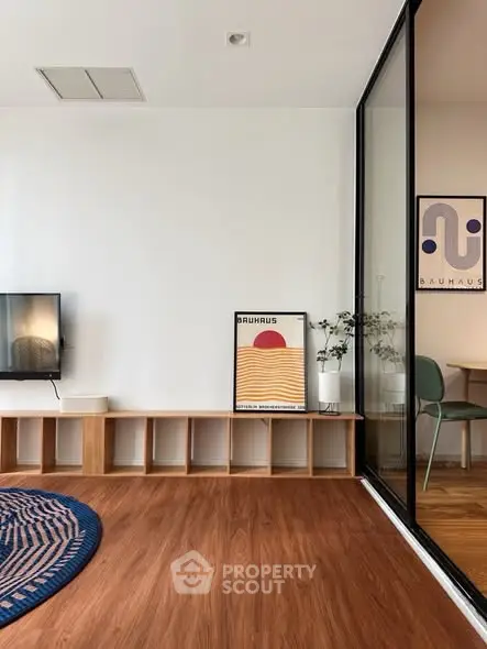 Modern living room with stylish decor and wooden flooring