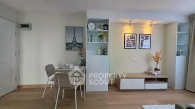 Stylish modern living room with elegant decor and cozy dining area, perfect for urban living.