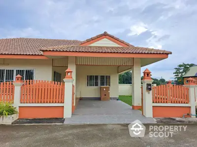 Charming suburban home with tiled roof and fenced yard, perfect for family living.