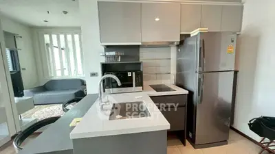 Modern kitchen with sleek appliances and open layout in a stylish apartment