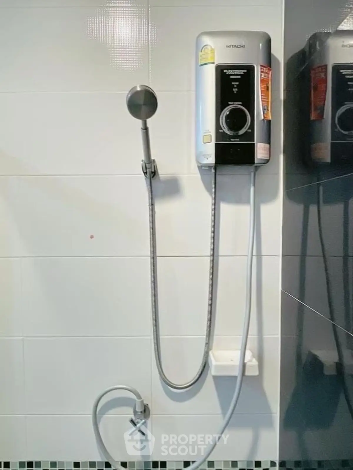 Modern bathroom with sleek shower unit and tiled walls