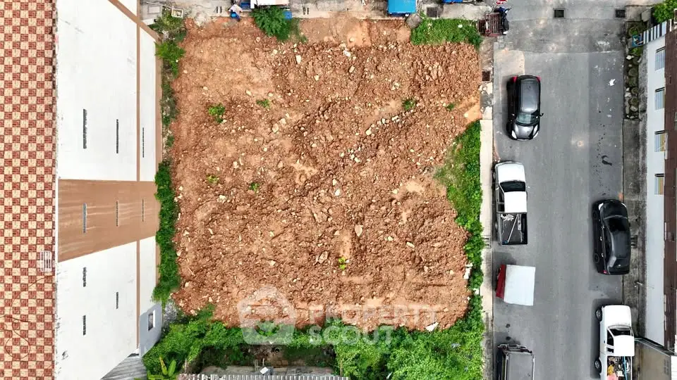Prime urban land plot for development with road access and potential for residential or commercial projects.