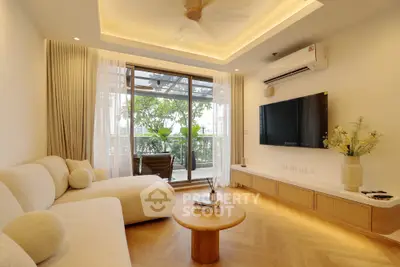 Elegant living room with modern decor and balcony view