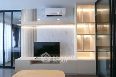Modern living room with sleek TV unit and ambient lighting