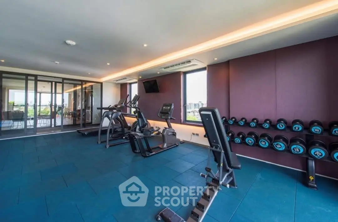 Modern gym with state-of-the-art equipment and city view