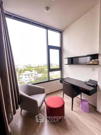 Modern study room with large window and stylish furniture