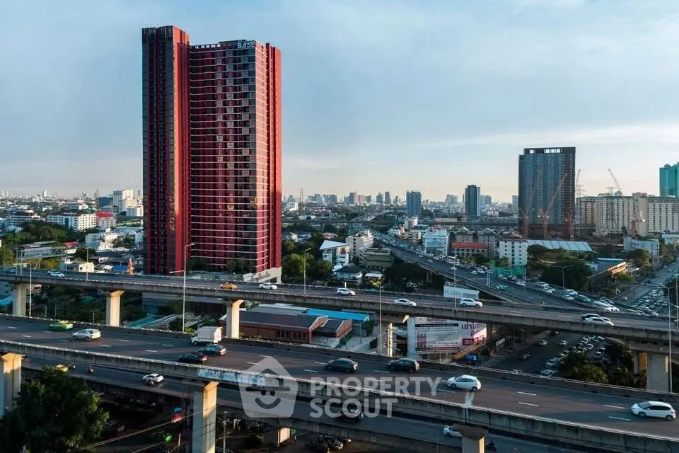 Stunning cityscape view with modern high-rise buildings and bustling highways.