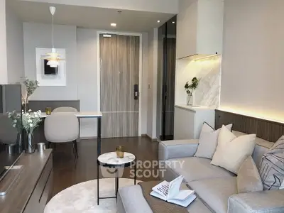 Modern living room with stylish decor and cozy seating area in a contemporary apartment.