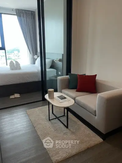 Modern living room with cozy sofa and stylish decor in a contemporary apartment.