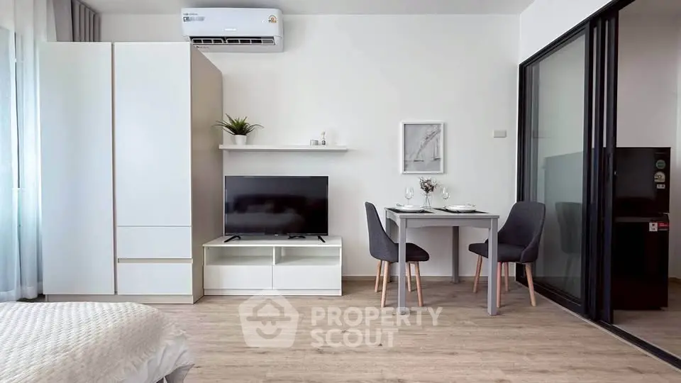 Modern studio apartment with sleek furniture and open layout