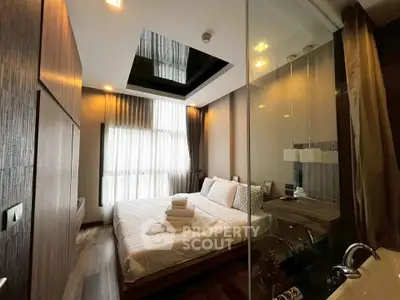 Luxurious modern bedroom with elegant design and ample natural light