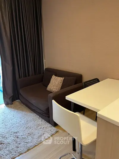 Cozy living room with modern sofa and breakfast bar in stylish apartment.