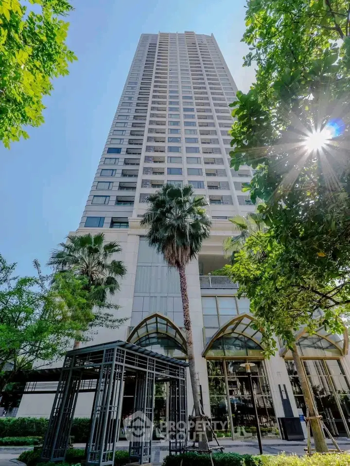 Stunning high-rise building with lush greenery and modern architecture, perfect for urban living.