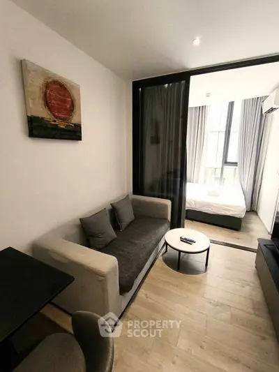 Modern studio apartment with cozy living area and stylish decor