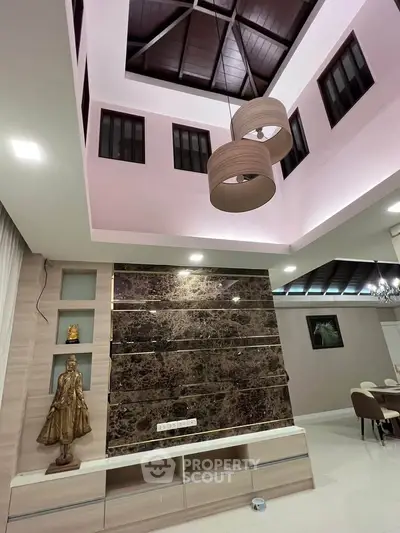 Luxurious modern living room with high ceiling and elegant decor