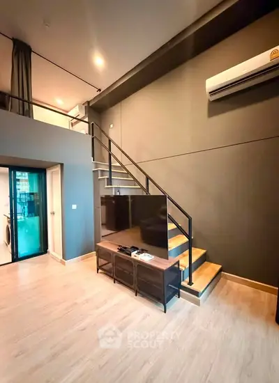Modern loft apartment with stylish staircase and sleek interior design