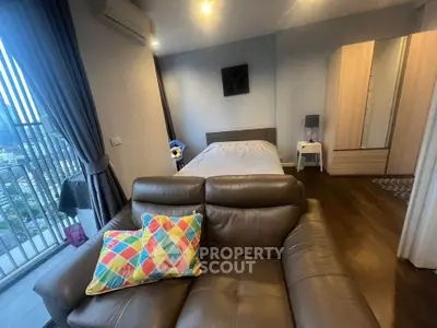 Modern bedroom with balcony view and stylish decor in urban apartment