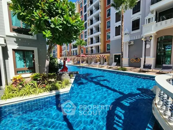 Luxurious apartment complex with stunning pool and lush landscaping.