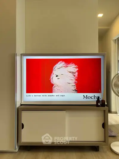 Modern living room with stylish TV stand and vibrant artwork, perfect for cozy relaxation.