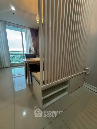 Modern apartment with stylish partition and stunning balcony view