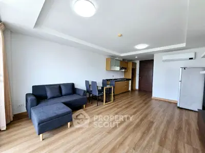 Spacious modern living room with open kitchen and stylish furniture