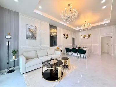 Luxurious living room with elegant chandeliers and modern decor