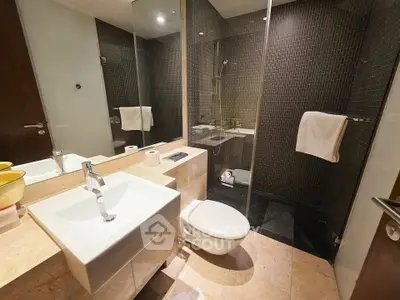 Modern bathroom with glass shower and sleek fixtures