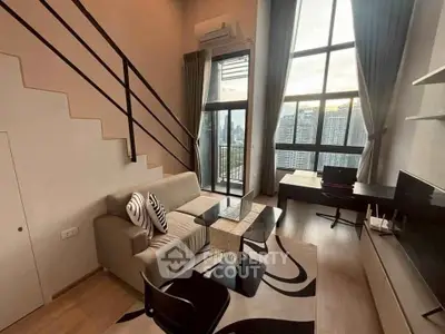 Modern loft apartment with high ceilings and city view