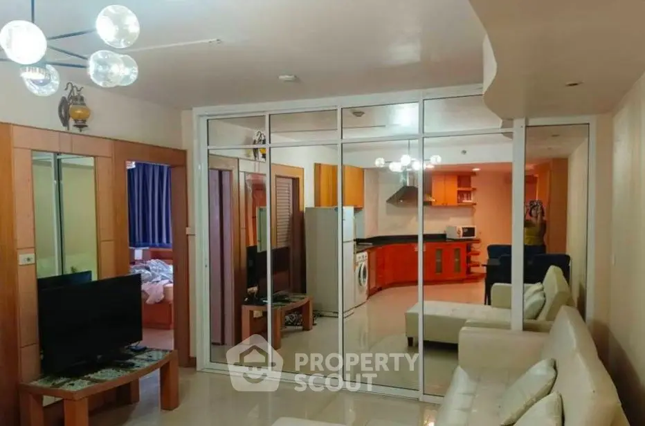 Spacious living room with modern decor and elegant lighting