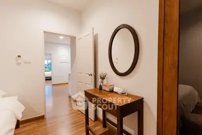 Cozy bedroom with wooden flooring and elegant decor