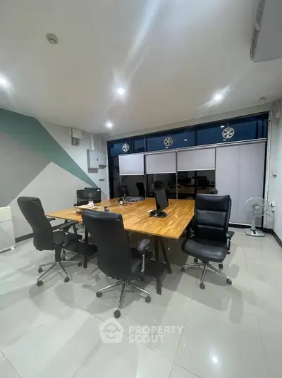 Modern office space with sleek furniture and ample lighting, ideal for productivity and collaboration.