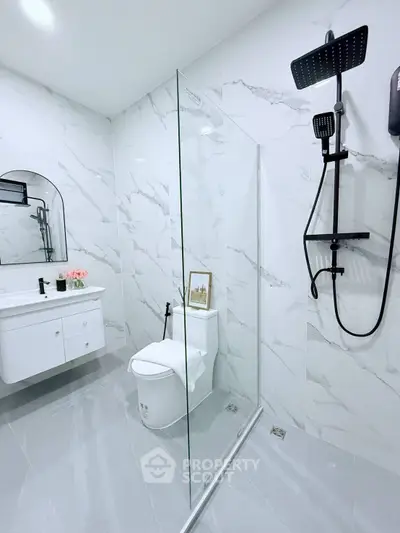 Modern bathroom with sleek shower and elegant marble tiles