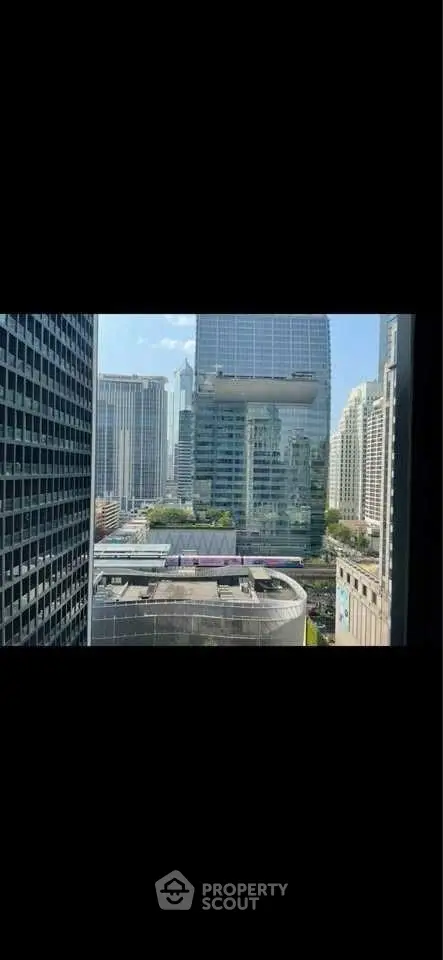 Stunning cityscape view from high-rise building window in urban setting.