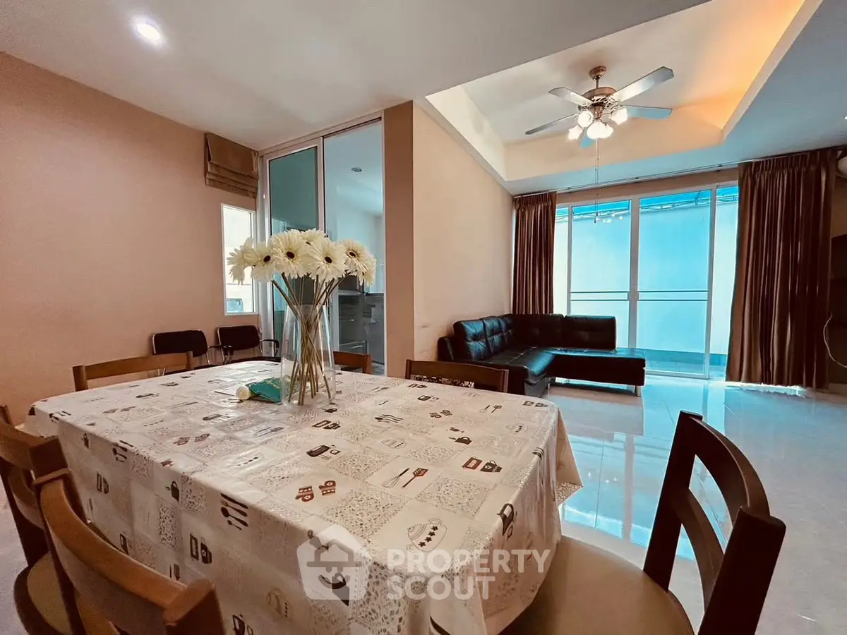 Spacious living room with dining area and modern decor