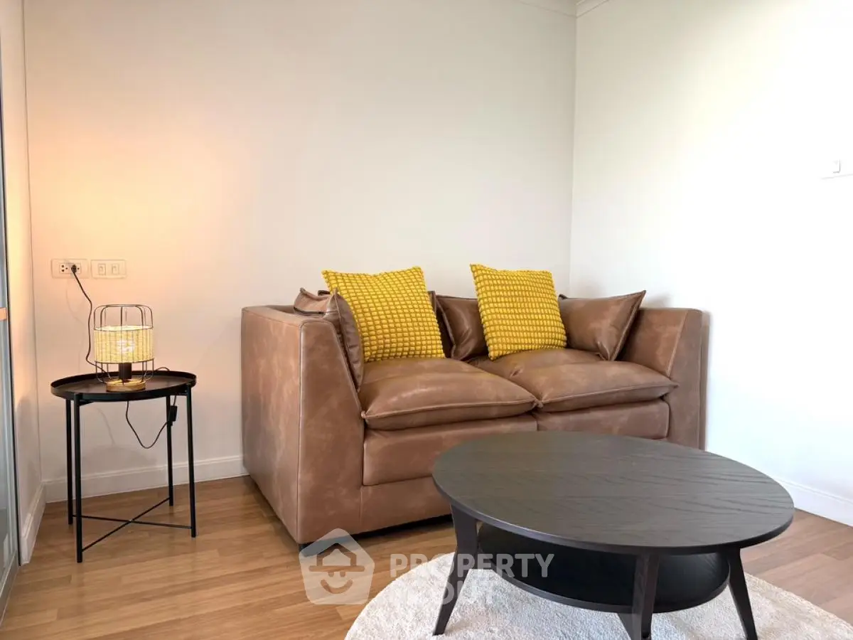 Cozy living room with stylish brown leather sofa and modern decor