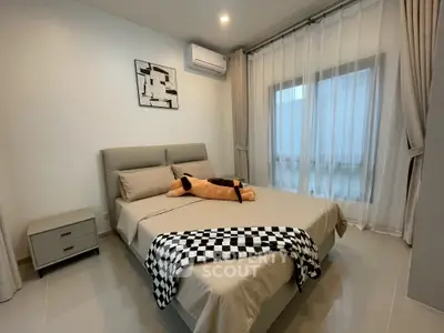 Cozy bedroom with modern decor and natural light