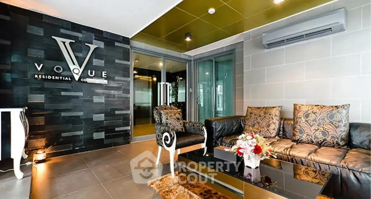 Luxurious residential lobby with elegant seating and modern decor at Vogue Residential Complex.