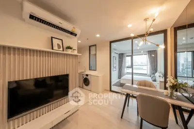 Modern open-plan living room with stylish decor and city view