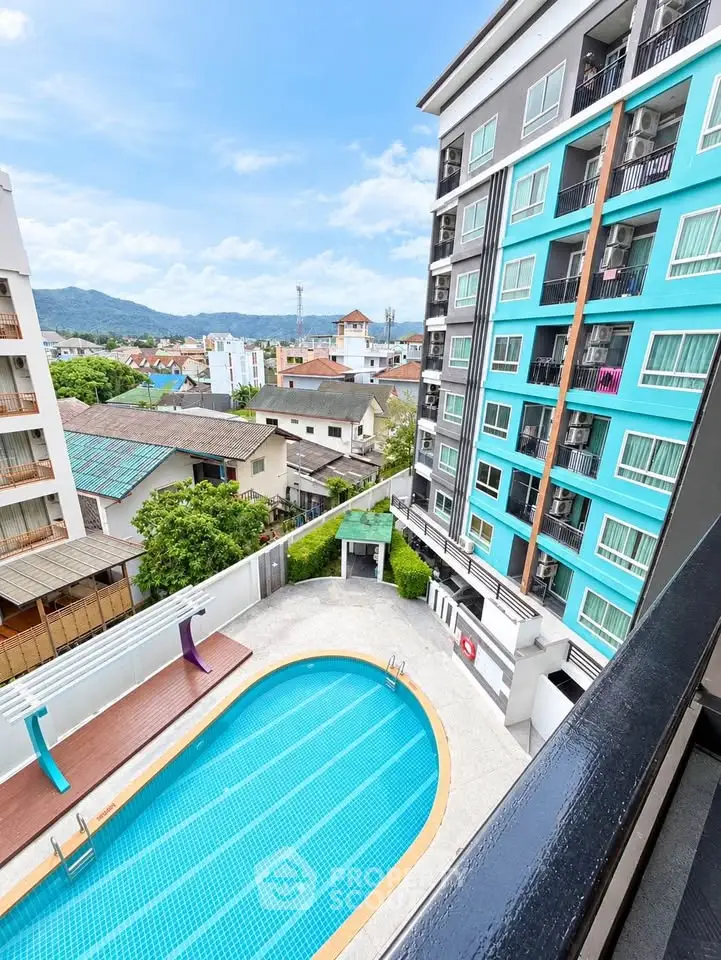 Modern apartment building with pool and scenic view