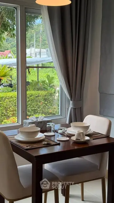 Cozy dining area with garden view and elegant table setting