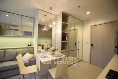 Modern living room with dining area and stylish decor in a cozy apartment.