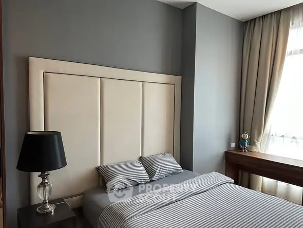 Modern bedroom with stylish decor and natural light
