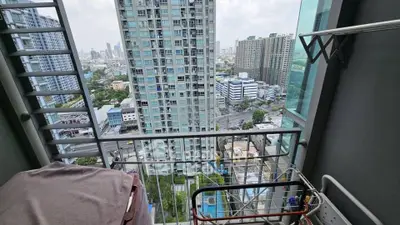High-rise balcony with cityscape view, perfect for urban living enthusiasts.