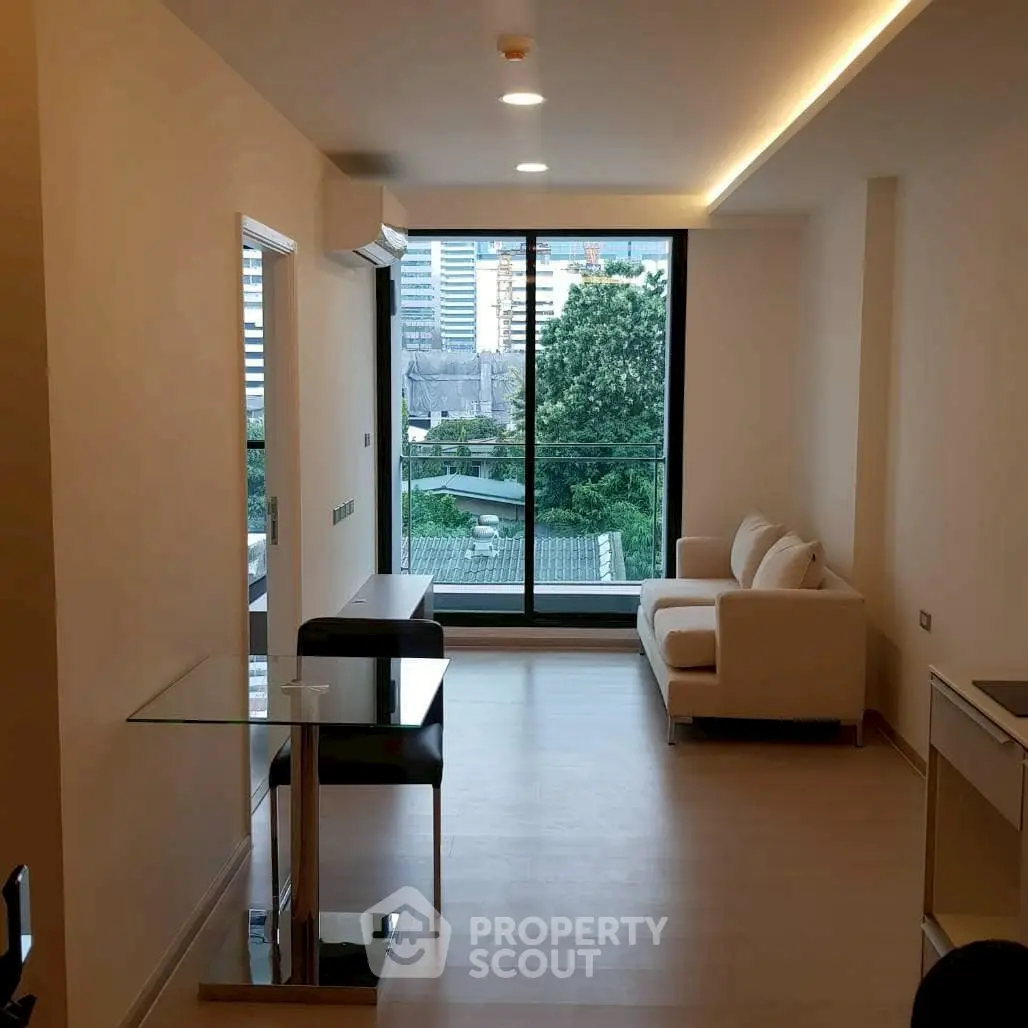 Modern living room with city view and sleek furniture