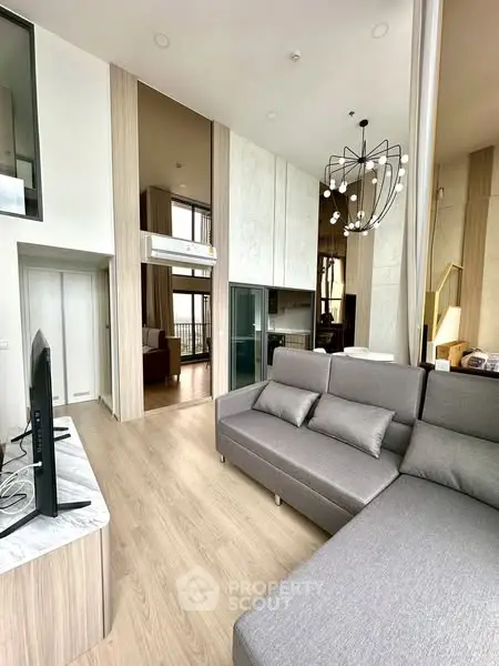 Modern living room with high ceilings and stylish decor in luxury apartment