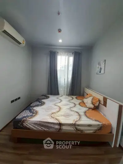 Cozy bedroom with modern decor and ample natural light