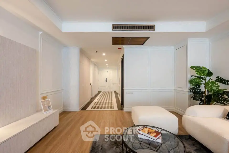 Spacious modern living room with elegant decor and wooden flooring