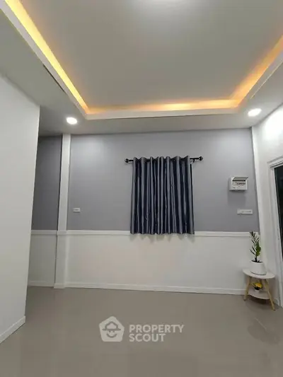 Modern minimalist interior with sleek lighting and elegant curtains.