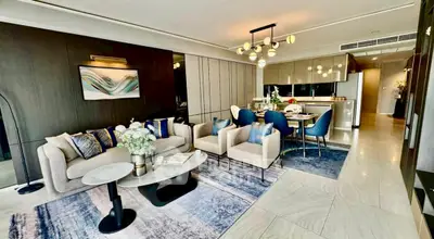 Luxurious modern living room with elegant decor and open kitchen layout, perfect for stylish urban living.