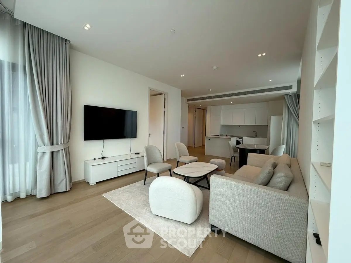 Modern living room with elegant decor and open kitchen layout